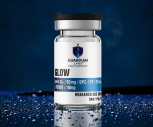 A glass vial with a black cap and a Guardian Labs label reading 'GLOW' on a blue surface, for research use only.