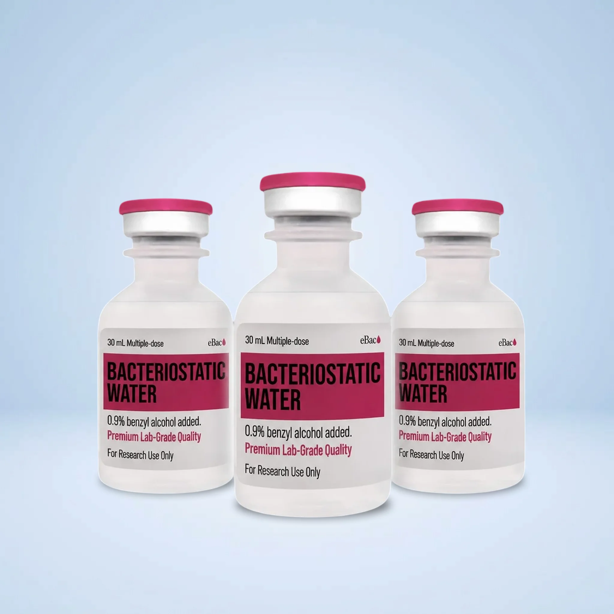 Bacteriostatic Water 30mL | Guardian Labs Three white 30 mL bacteriostatic water vials with pink caps standing against a light blue background.