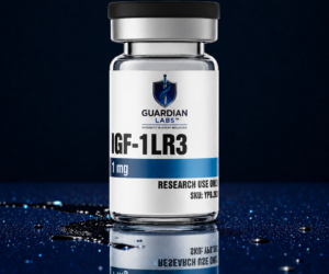 Crystal glass vial with a black cap and a white label that reads IGF-1LR3, Guardian Labs, 'Research Use Only' on a glossy blue surface.